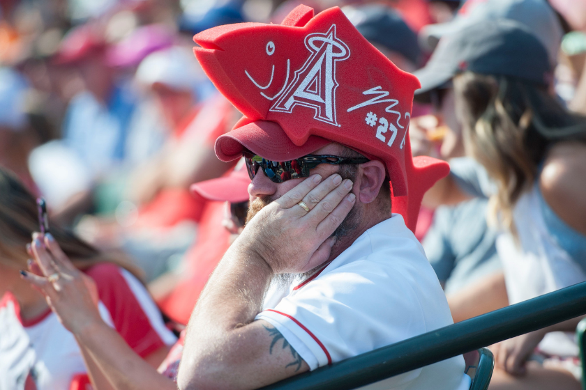 A disappointed Angels fan watches his team. 