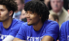 Shaedon Sharpe sits on the Kentucky Wildcats bench during a game agains Mississippi State