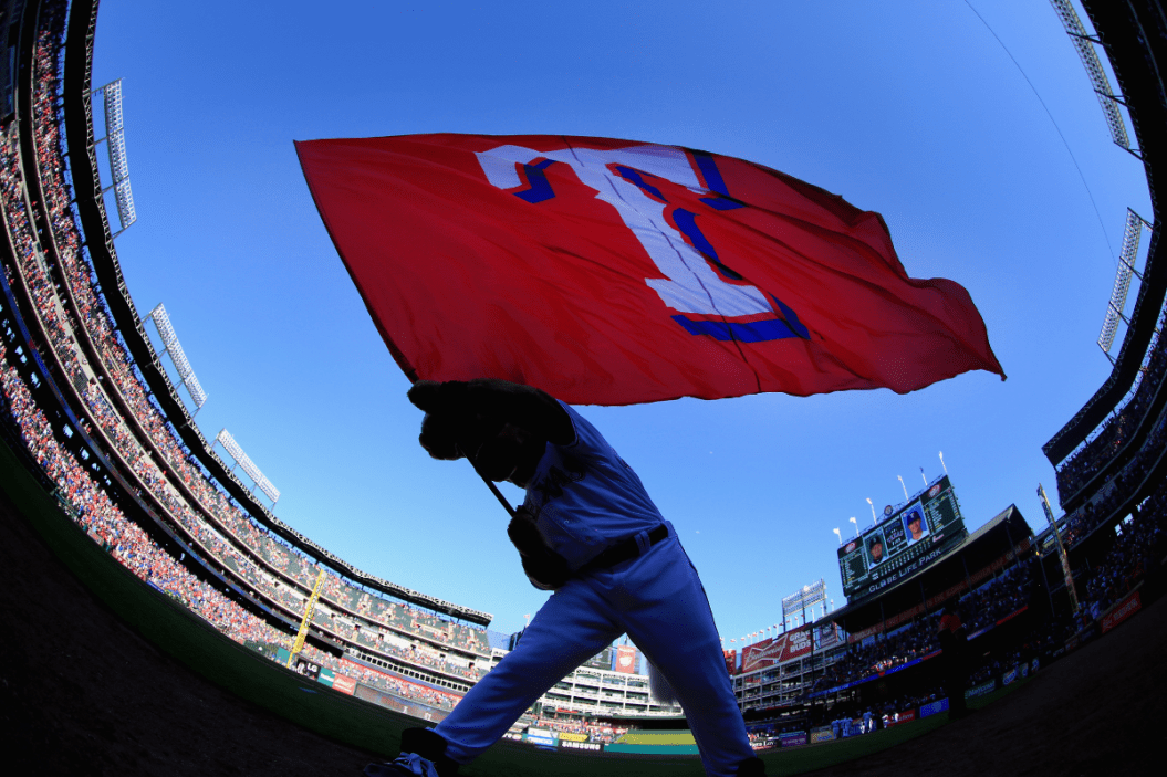 Texas Rangers mascot Captain waves a flag on 2016 opening day.