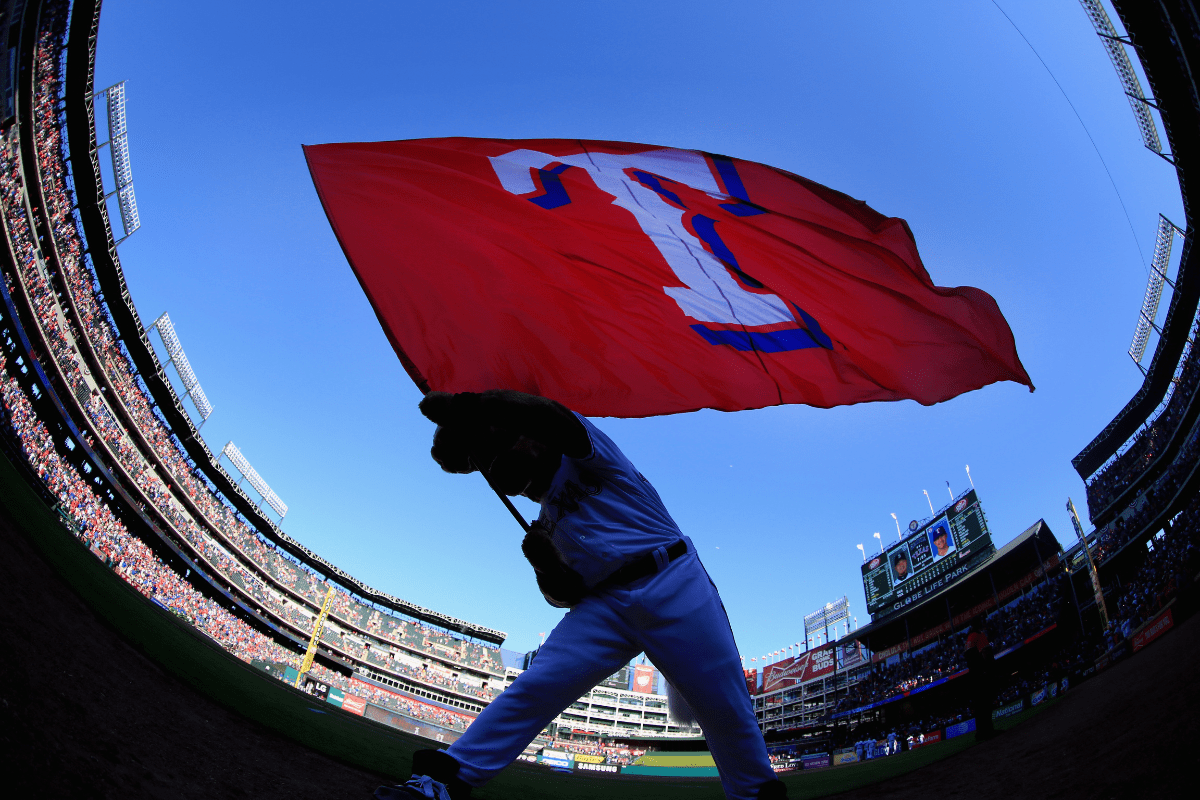 Texas Rangers mascot Captain waves a flag on 2016 opening day.