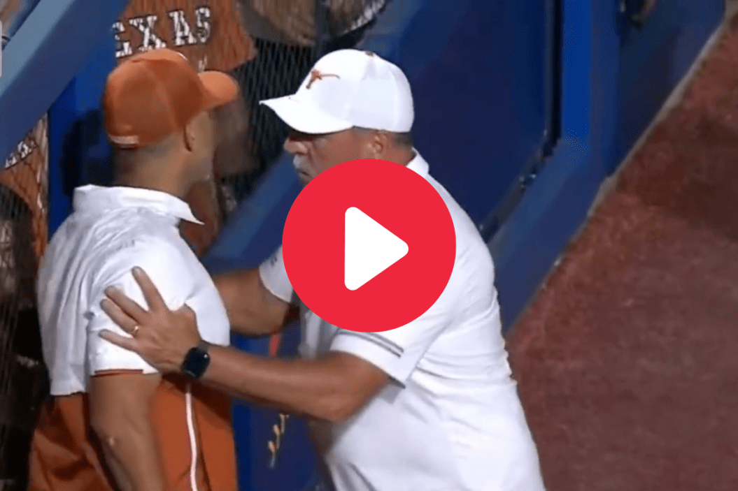 Texas assistant coach Steve Singleton had to be restrained at the WCWS.