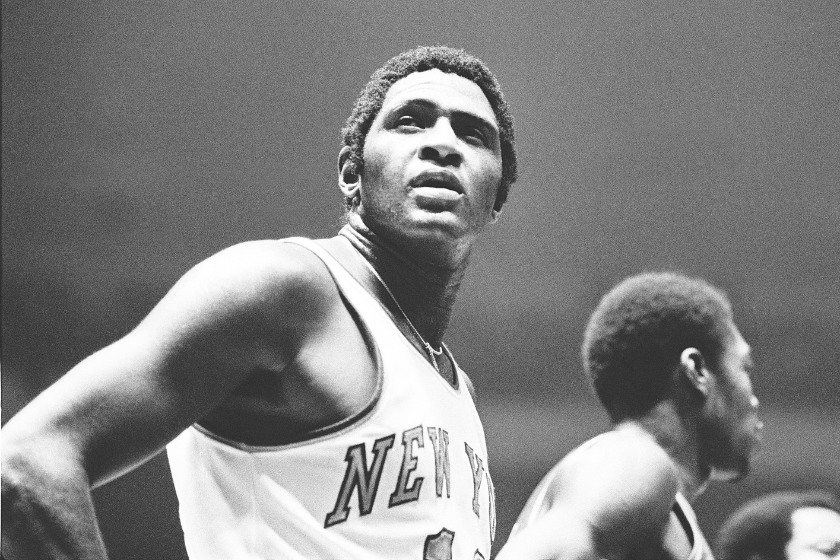 Willis Reed looks up at the scoreboard during a New York Knicks game. 