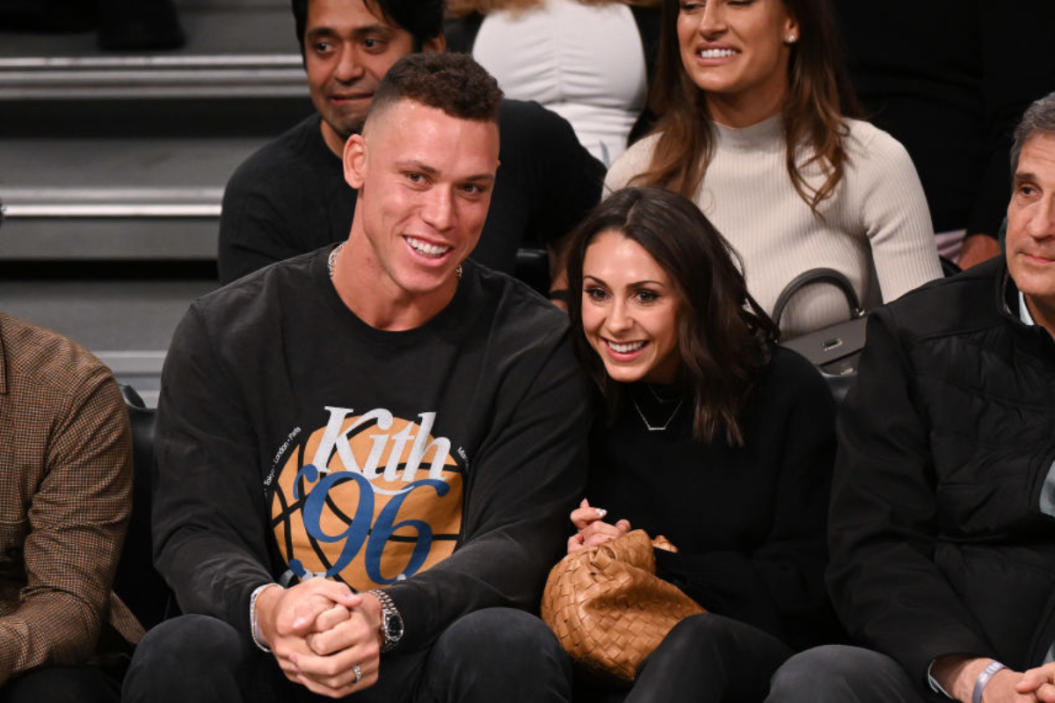 Aaron Judge and Samantha Bracksieck attend Brooklyn Nets v Boston Celtics game at Barclays Center