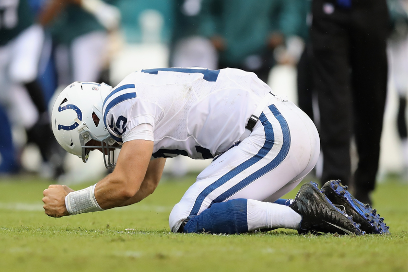 Quarterback Andrew Luck #12 of the Indianapolis Colts reacts after being sacked by defensive end Derek Barnett #96 of the Philadelphia Eagles