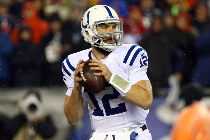 Andrew Luck #12 of the Indianapolis Colts looks to throw a pass during the first quarter against the New England Patriots in the 2015 AFC Championship Game 