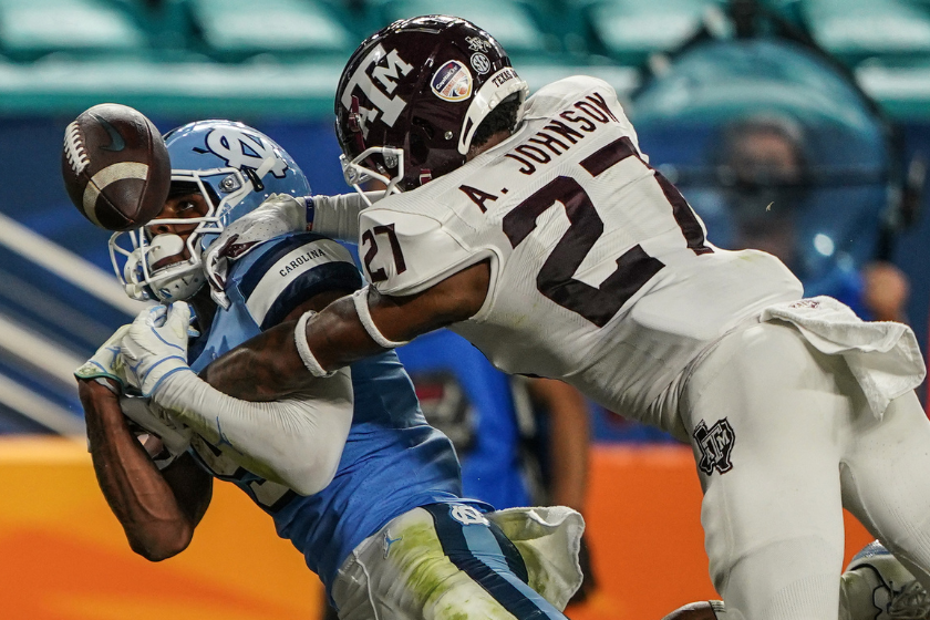 Texas A&M Aggies defensive back Antonio Johnson defends against a wideout from the North Carolina Tar Heels