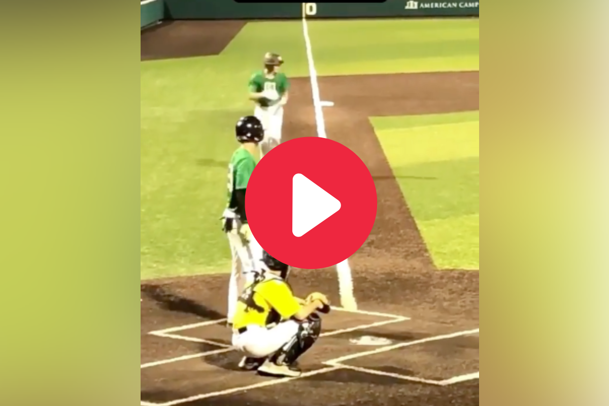 A high school baseball player stole home as the catcher stood there frozen with the ball.