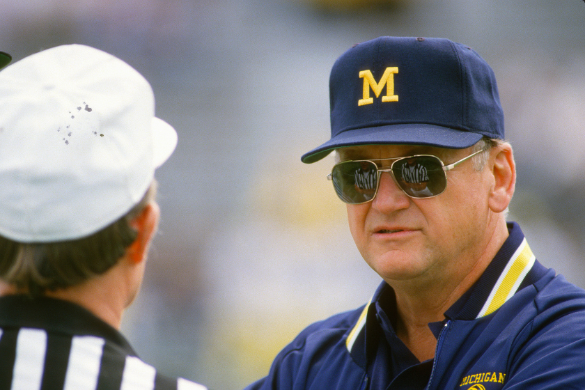  Head Coach Bo Schembechler of the Michigan Wolverines talks with an official while his team warms up