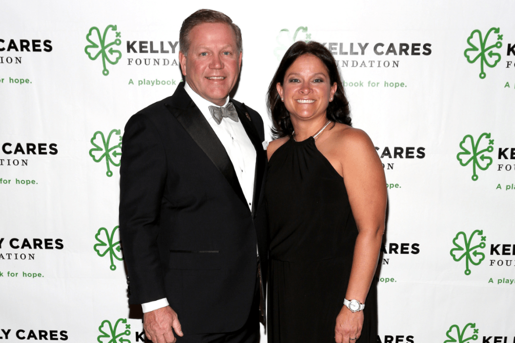 Brian Kelly and his wife Paqui attend the 2014 Kelly Cares Foundation Irish Eyes Gala.