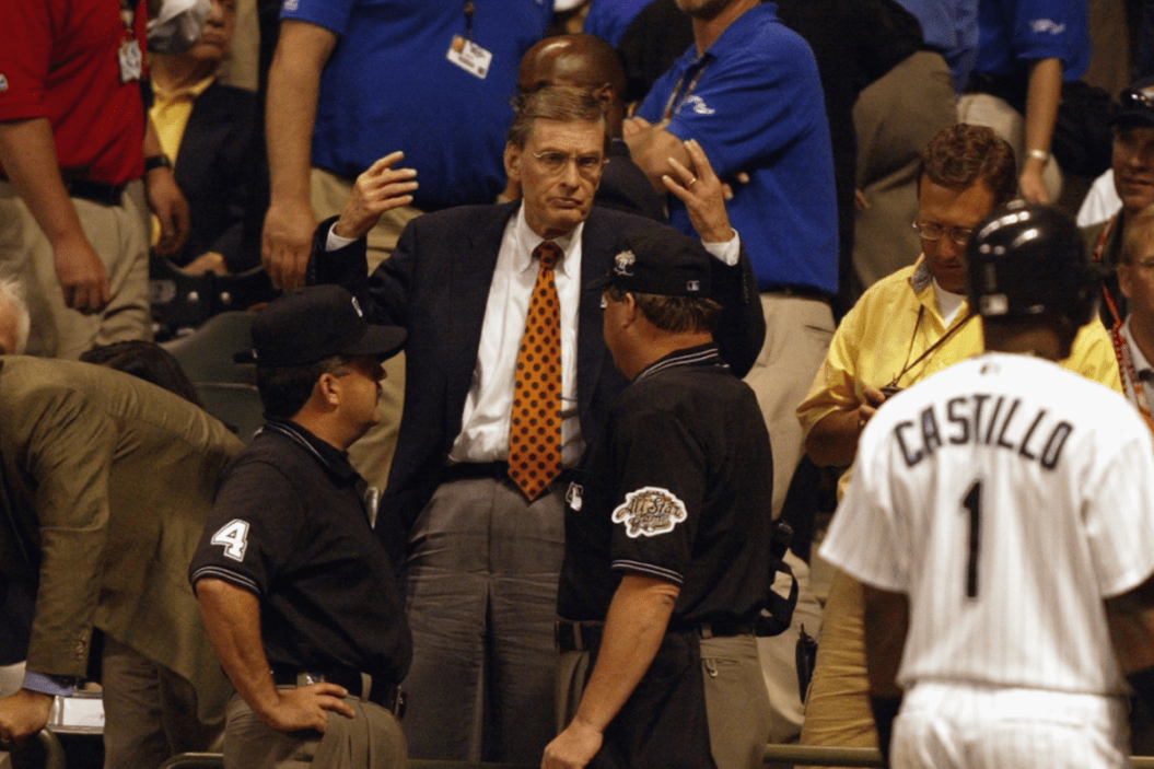 MLB Comissioner Bud Selig confers with the game umpires in the 11th inning during the 2002 MLB All Star Game