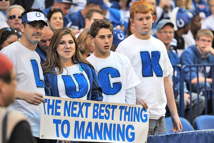 Indianapolis Colts fans with LUCK: THE NEXT BEST THING TO MANNING sign in stands during game vs Atlanta Falcons at Lucas Oil Stadium. These fans are hoping to draft Stanford QB Andrew Luck to replace current quarterback Manning who had season-ending surgery for a neck injury