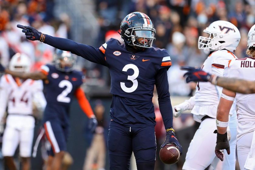 University of Virginia wideout Dontayvion Wicks signals a first down in a game against Virginia Tech.