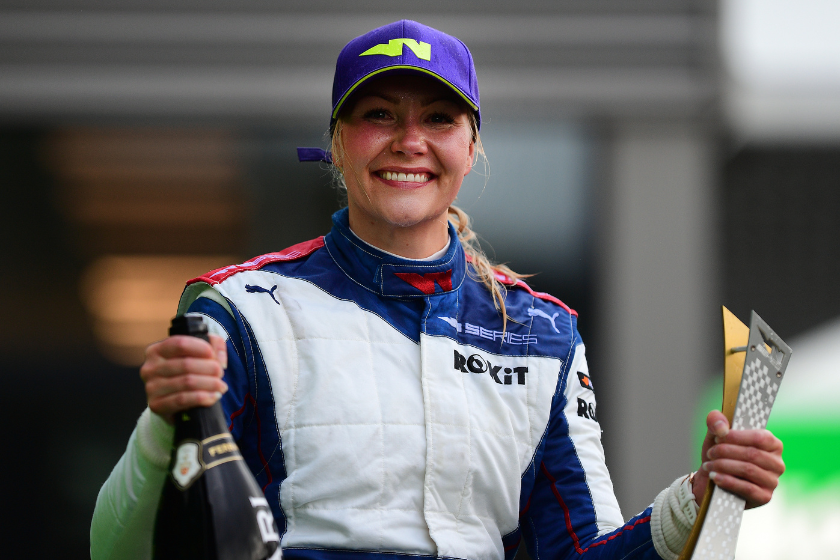 Emma Kimilainen celebrates on the podium during the W Series Round 5 race at Circuit de Spa-Francorchamps on August 28, 2021 in Spa, Belgium