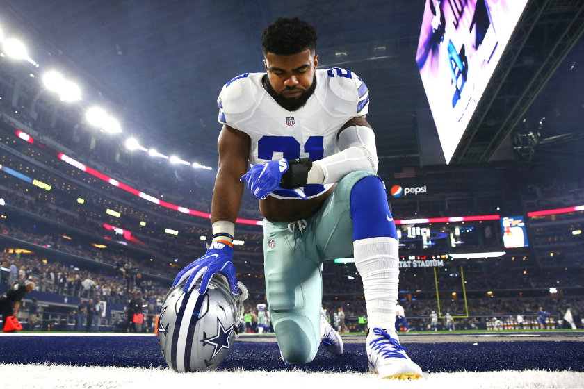 Ezekiel Elliot of the Dallas Cowboys takes a knee in the end zone before the Cowboys played the Detroit Lions