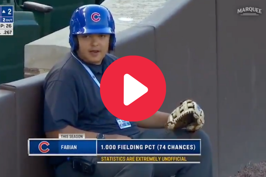 Fabian the ball boy smiles during a Chicago Cubs game.