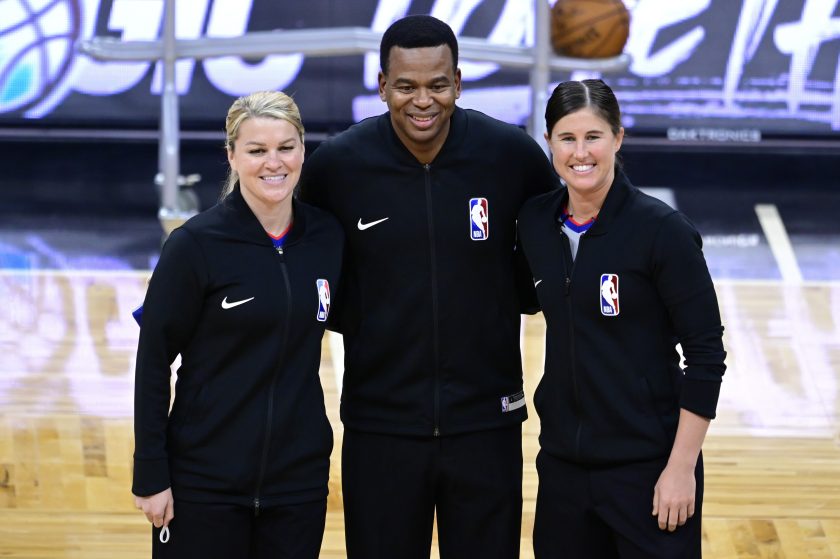 Natalie Sago and Jenna Schroeder pose with Sean Wright before officiating a game together on January 25, 2021