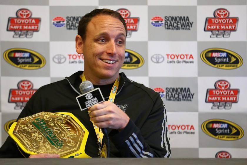Joey Chestnut smiles at a NASCAR event.