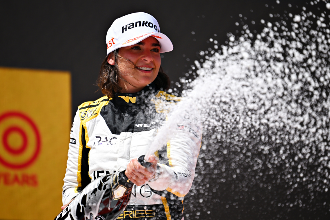 Jamie Chadwick celebrates on the podium during the W Series Round 2 race at Circuit de Barcelona-Catalunya on May 21, 2022 in Barcelona, Spain
