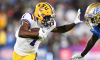 LSU Tigers Wide Receiver Kayshon Boutte (1) battles with UCLA Bruins defensive back Mo Osling III (7) during a college football game between the LSU Tigers and the UCLA Bruins