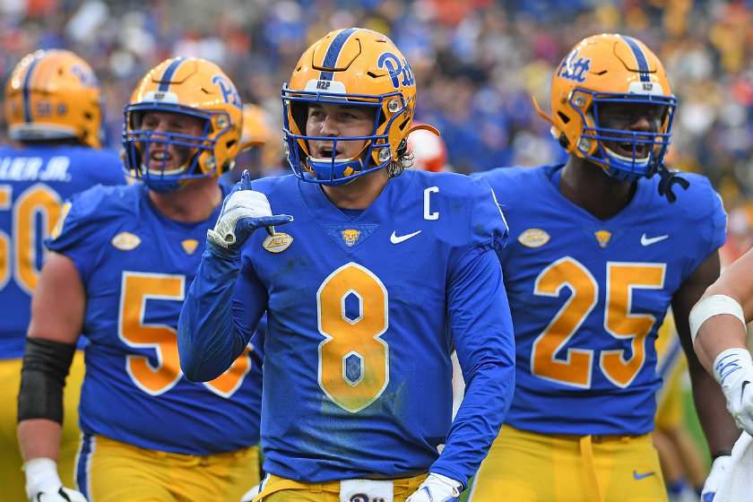 Kenny Pickett and his fellow Pitt Panther teammates in a game against Clemson