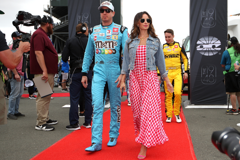 Kyle Busch and wife Samantha Busch walk the red carpet prior to the NASCAR Cup Series ToyotaSave Mart 350 at Sonoma Raceway on June 12, 2022