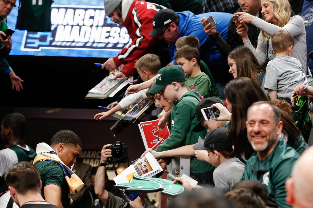 Michigan State Spartans guard Miles Bridges signs autographs for fans during an open public practice during the practice day before the first round of the 2018 NCAA Tournament.