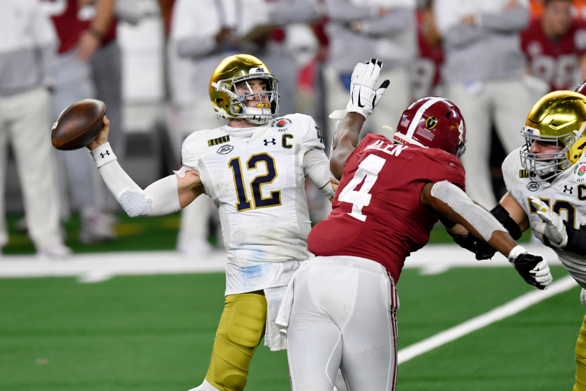 Notre Dame QB Ian Book drops back to pass against Alabama.