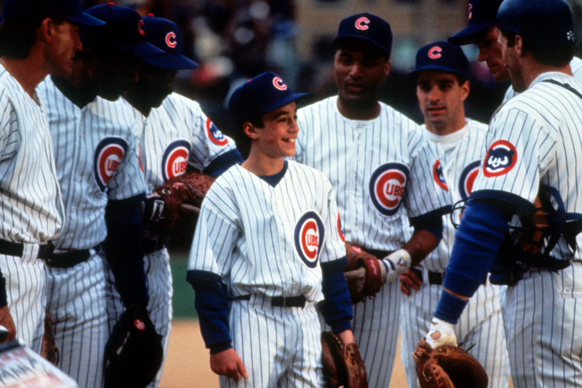 Thomas Ian Nicholas surrounded by teammates in a scene from the film 'Rookie Of The Year'.