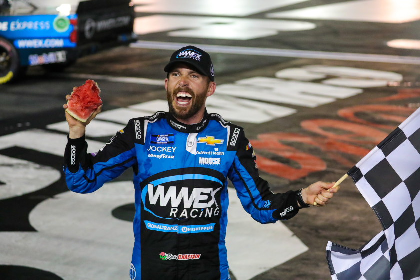 Ross Chastain celebrates by eating a smashed watermelon after winning the Camping World Truck Series North Carolina Education Lottery 200 on May 27, 2022, at Charlotte Motor Speedway