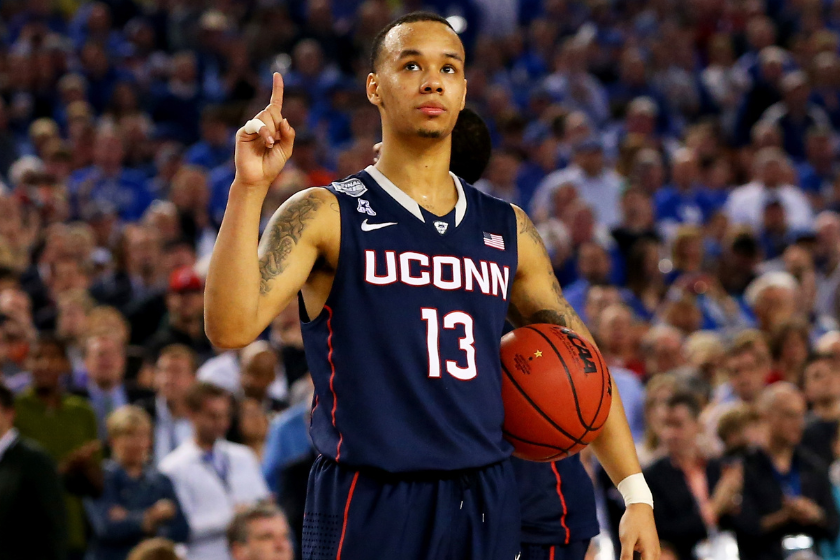 Shabazz Napier of the Connecticut Huskies celebrates during the NCAA Men's Final Four Semifinal against the Florida Gators.