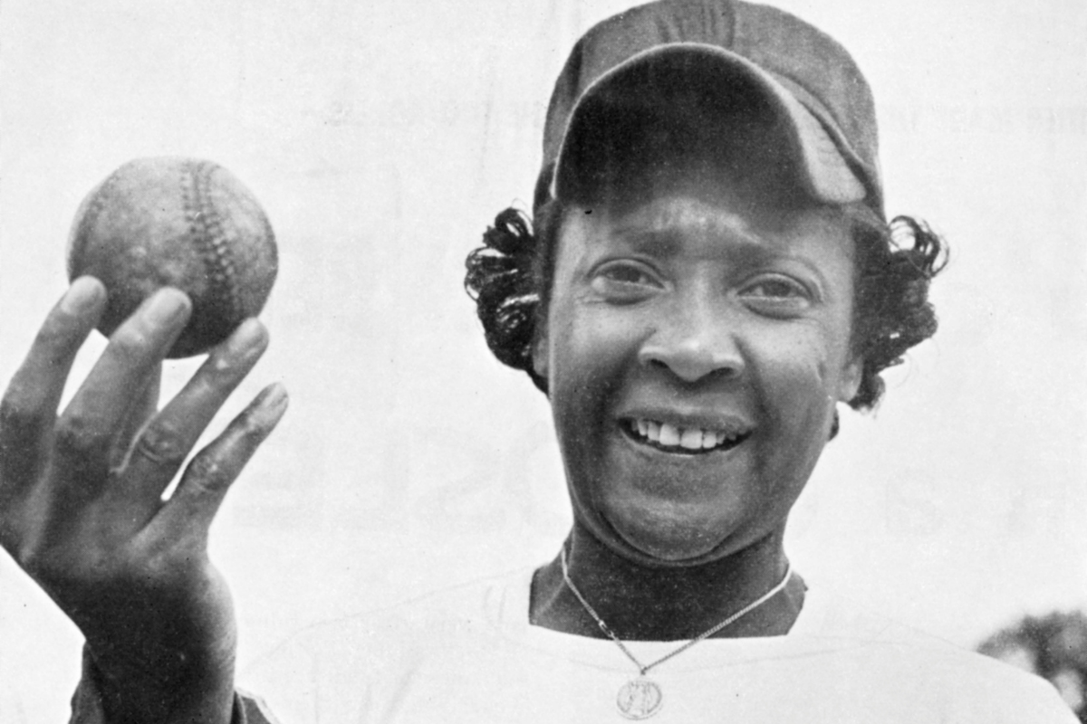Toni Stone poses with a baseball while in Florida with the Indianapolis Clowns