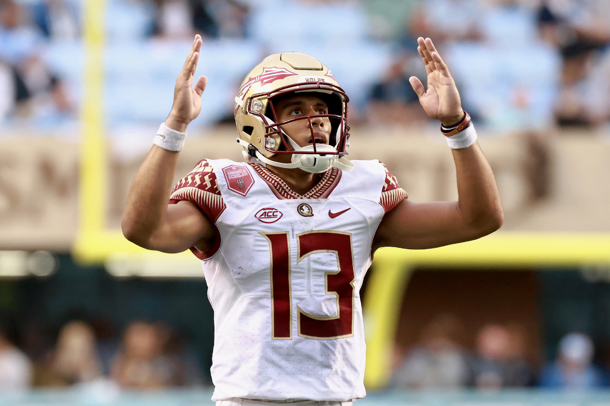 Jordan Travis #13 of the Florida State Seminoles reacts as he waits for a replay decision on a touchdown call