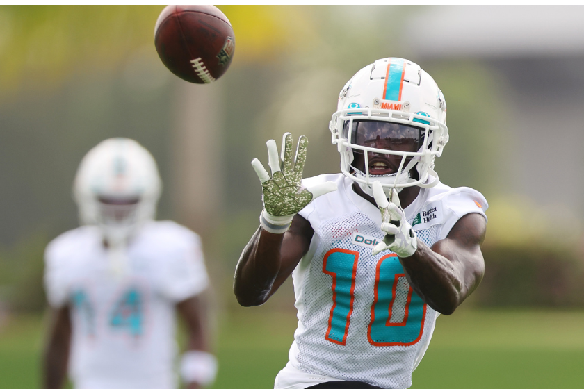 Tyreek Hill #10 of the Miami Dolphins catches a pass during training camp at Baptist Health Training Complex 