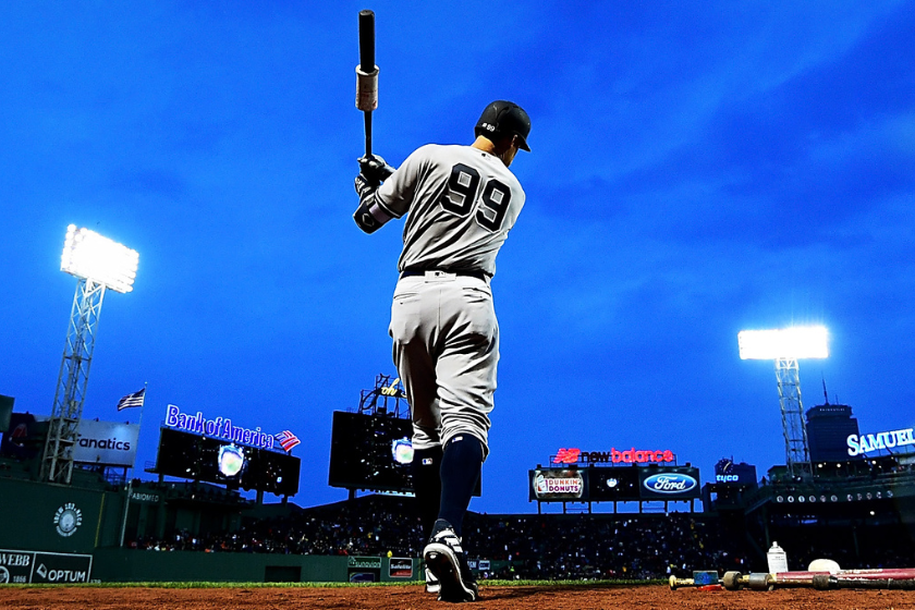 Aaron Judge #99 of the New York Yankees warms up in the on deck circle before a game against the Boston Red Sox