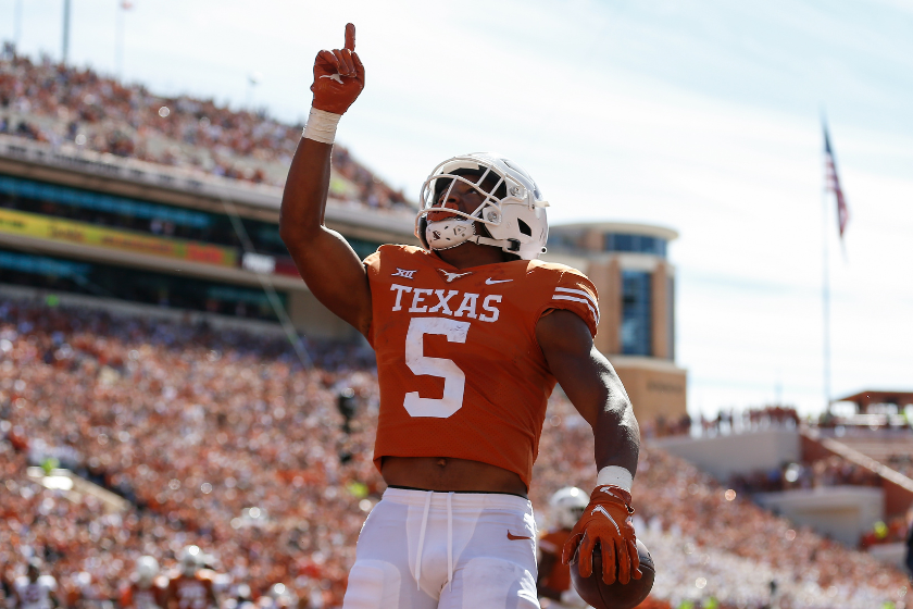 Bijan Robinson #5 of the Texas Longhorns reacts after a second quarter touchdown against the Oklahoma State Cowboys