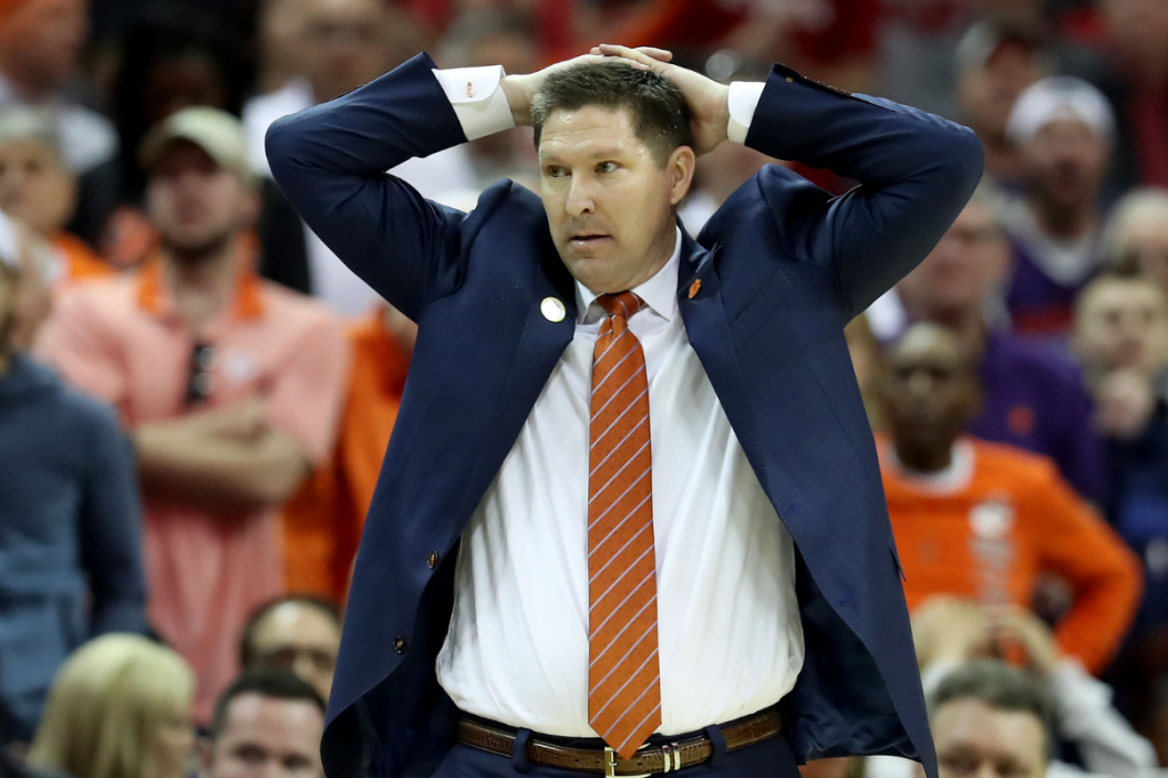 Head coach Brad Brownell of the Clemson Tigers reacts after a play against the NC State Wolfpack