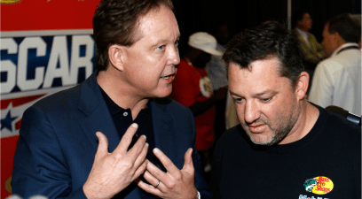 Brian France talks with Tony Stewart at the drivers meeting prior to the NASCAR Sprint Cup Series Axalta 'We Paint Winners' 400 at Pocono Raceway on June 7, 2015