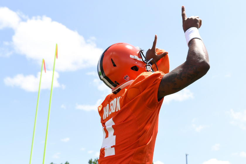 Deshaun Watson #4 of the Cleveland Browns celebrates as he walks onto the field during Cleveland Browns training camp