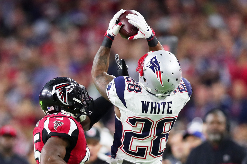 James White #28 of the New England Patriots makes a catch over Deion Jones #45 of the Atlanta Falcons in the first quarter during Super Bowl 51