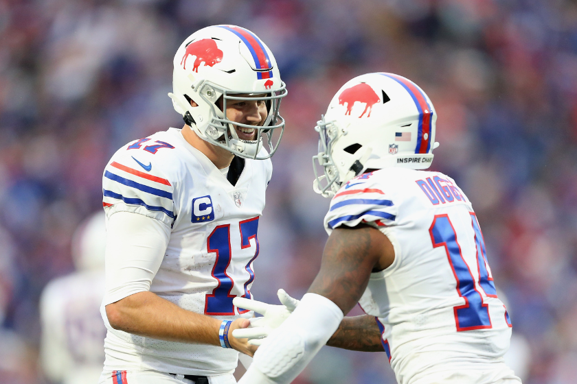 Josh Allen #17 and Stefon Diggs #14 of the Buffalo Bills celebrate after scoring a touchdown in the fourth quarter against the Miami Dolphins