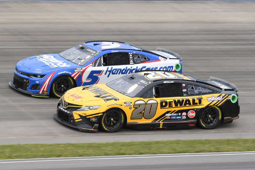 Kyle Larson and Christopher Bell race side by side during the running of the 2022 Ally 400 at Nashville Superspeedway