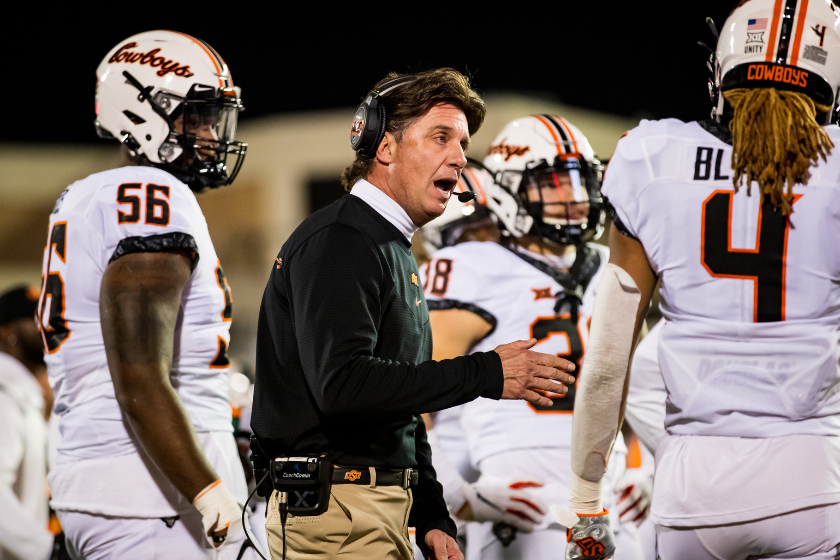 Mike Gundy coaches the Oklahoma State Cowboys against Texas Tech.