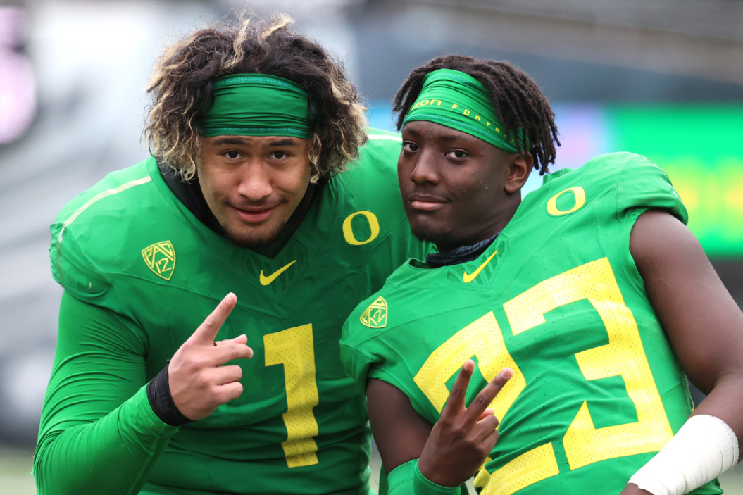 Noah Sewell #1 and Verone McKinley III #23 of the Oregon Ducks pose during the Oregon spring game