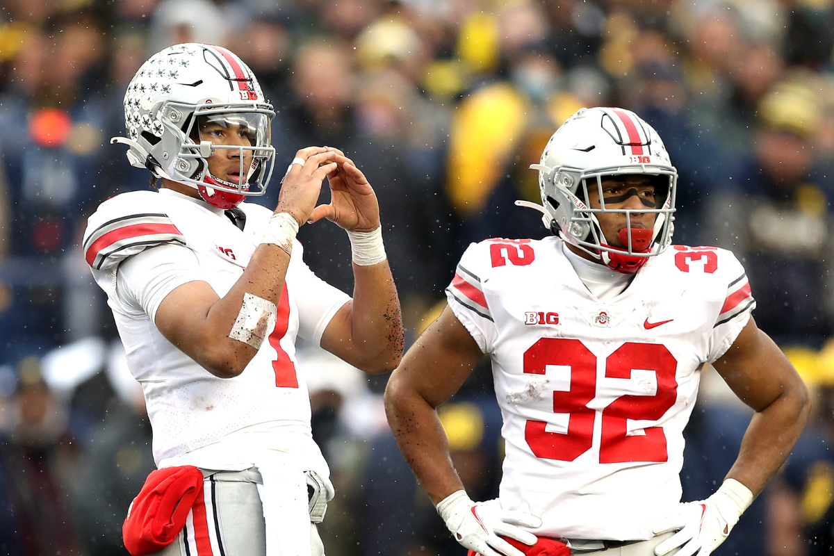 C.J. Stroud #7 and TreVeyon Henderson #32 of the Ohio State Buckeyes stand on the field during the fourth quarter of "The Game"