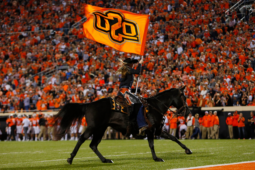 Bullet, a mascot of the Oklahoma State Cowboys, runs around the field after a touchdown against the Texas Longhorns 