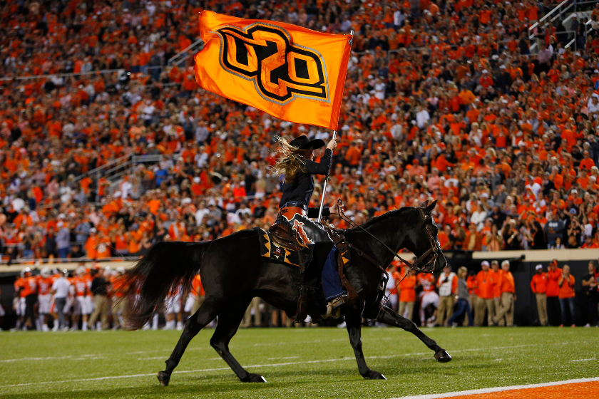 Bullet, a mascot of the Oklahoma State Cowboys, runs around the field after a touchdown against the Texas Longhorns