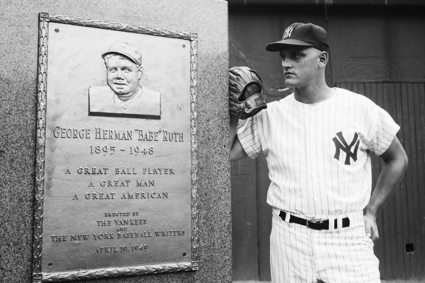 Roger Maris contemplates Babe Ruth's memorial plaque in Yankee Stadium. Within a month, Maris would break Ruth's home run record