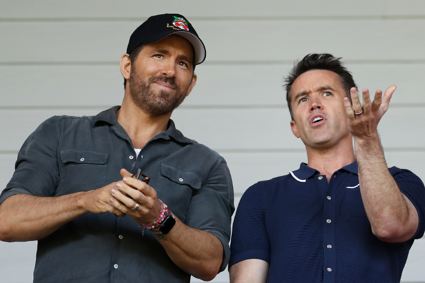 Ryan Reynolds, Owner of Wrexham and Rob McElhenney, Actor and Co-Owner of Wrexham react prior to the Vanarama National League Play-Off Semi Final match between Wrexham and Grimsby Town(Photo by Lewis Storey/Getty Images