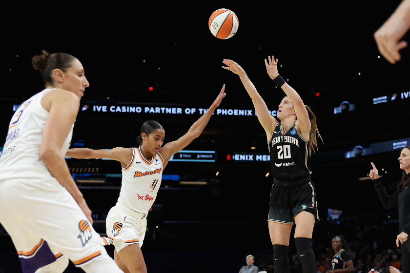Sabrina Ionescu #20 of the New York Liberty attempts a three-point shot over Skylar Diggins-Smith #4 of the Phoenix Mercury during the first half of the WNBA game