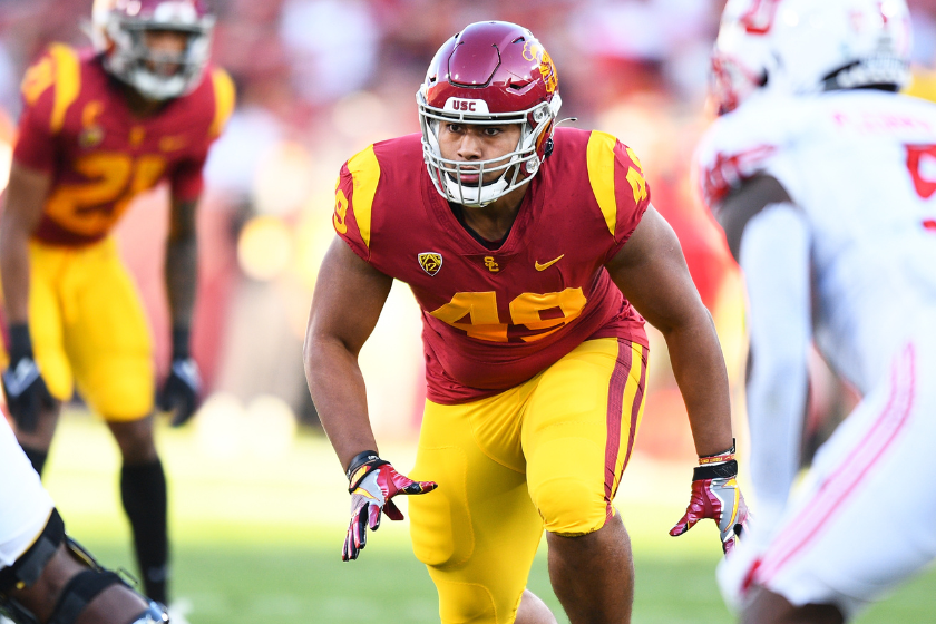 USC Trojans defensive lineman Tuli Tuipulotu (49) looks to runs the passer during a college football game between the Utah Utes and the USC TrojansPhoto by Brian Rothmuller/Icon Sportswire via Getty Images